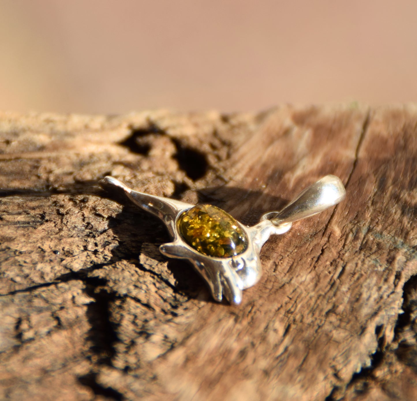 Delicate pendant with a joyful dolphin in natural green amber and 925 silver, MJ Baltica, BW320