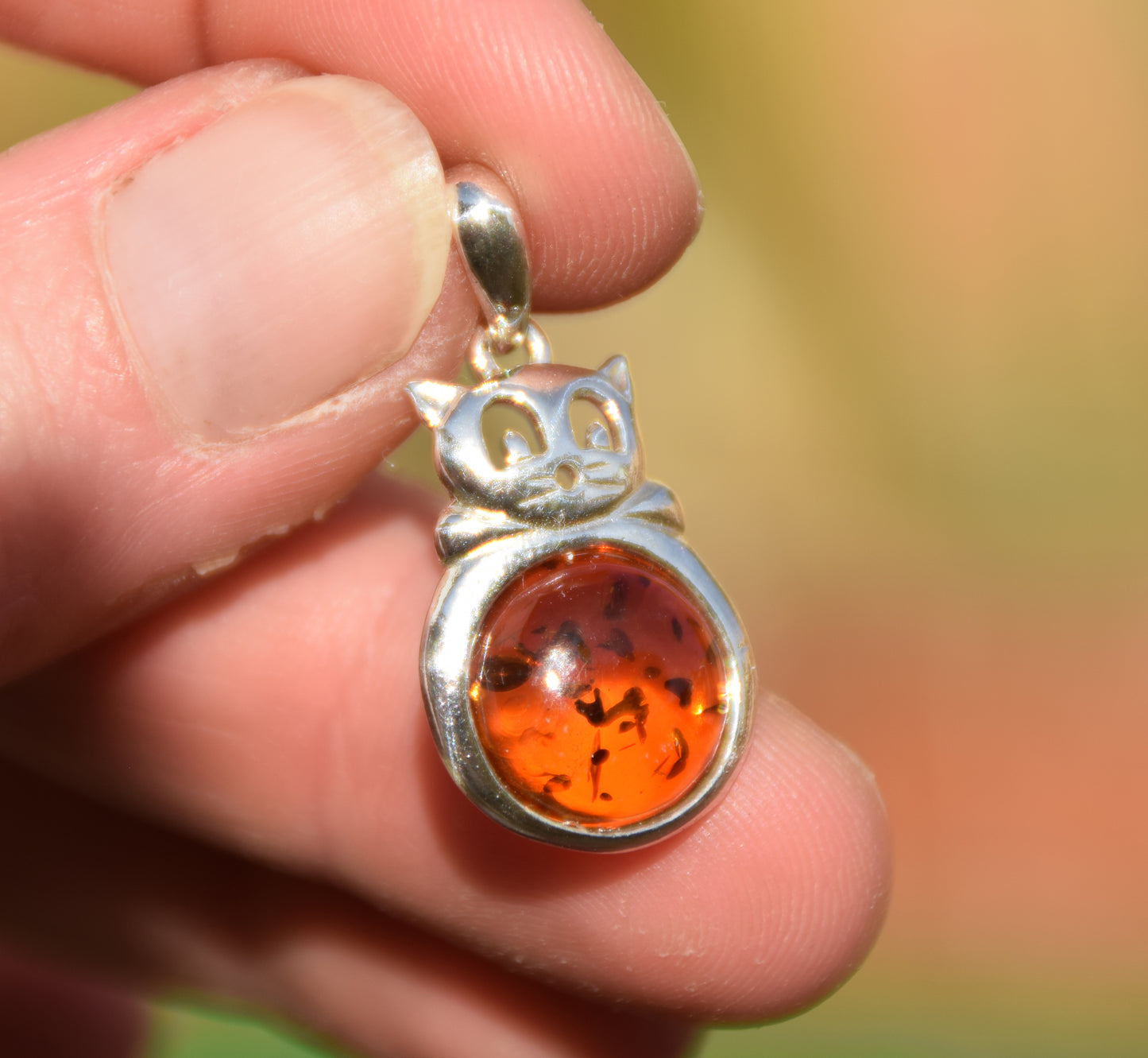 Delicate fat cat pendant in cognac-colored natural amber and 925 sterling silver, MJ Baltica, BW323