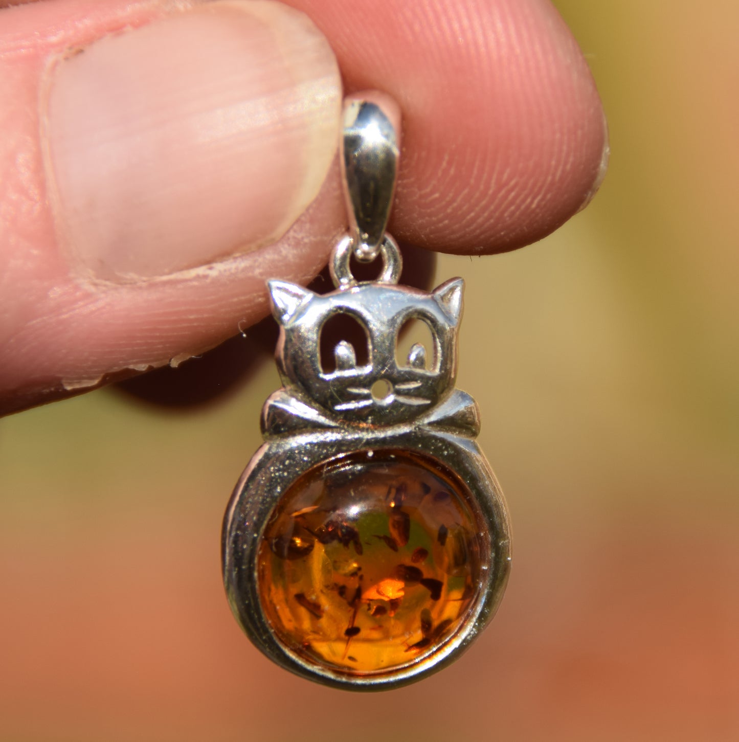 Delicate fat cat pendant in cognac-colored natural amber and 925 sterling silver, MJ Baltica, BW323