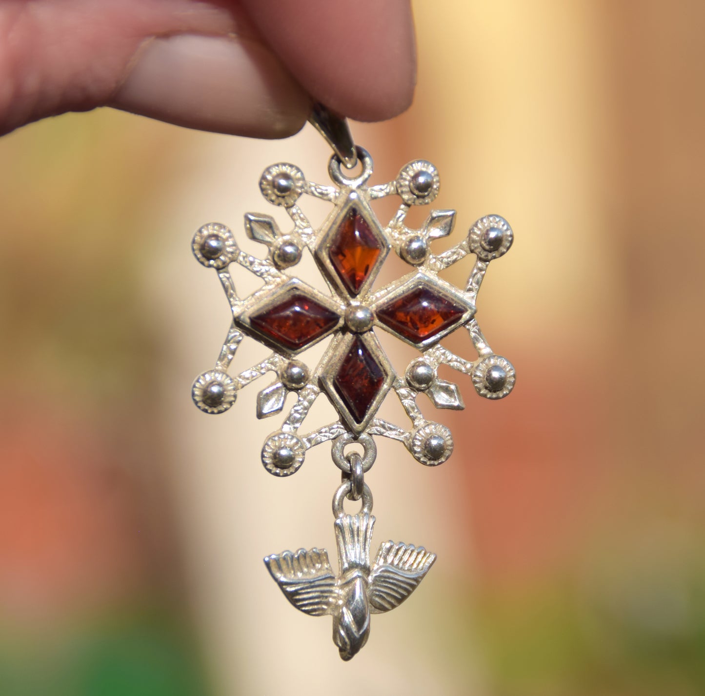Cross-shaped pendant with a dove in natural brown amber and 925 Sterling Silver, MJ Baltica, BW326
