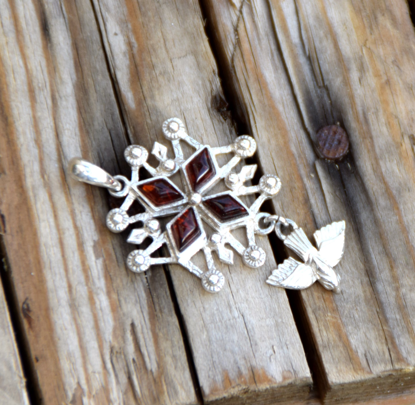 Cross-shaped pendant with a dove in natural brown amber and 925 Sterling Silver, MJ Baltica, BW326