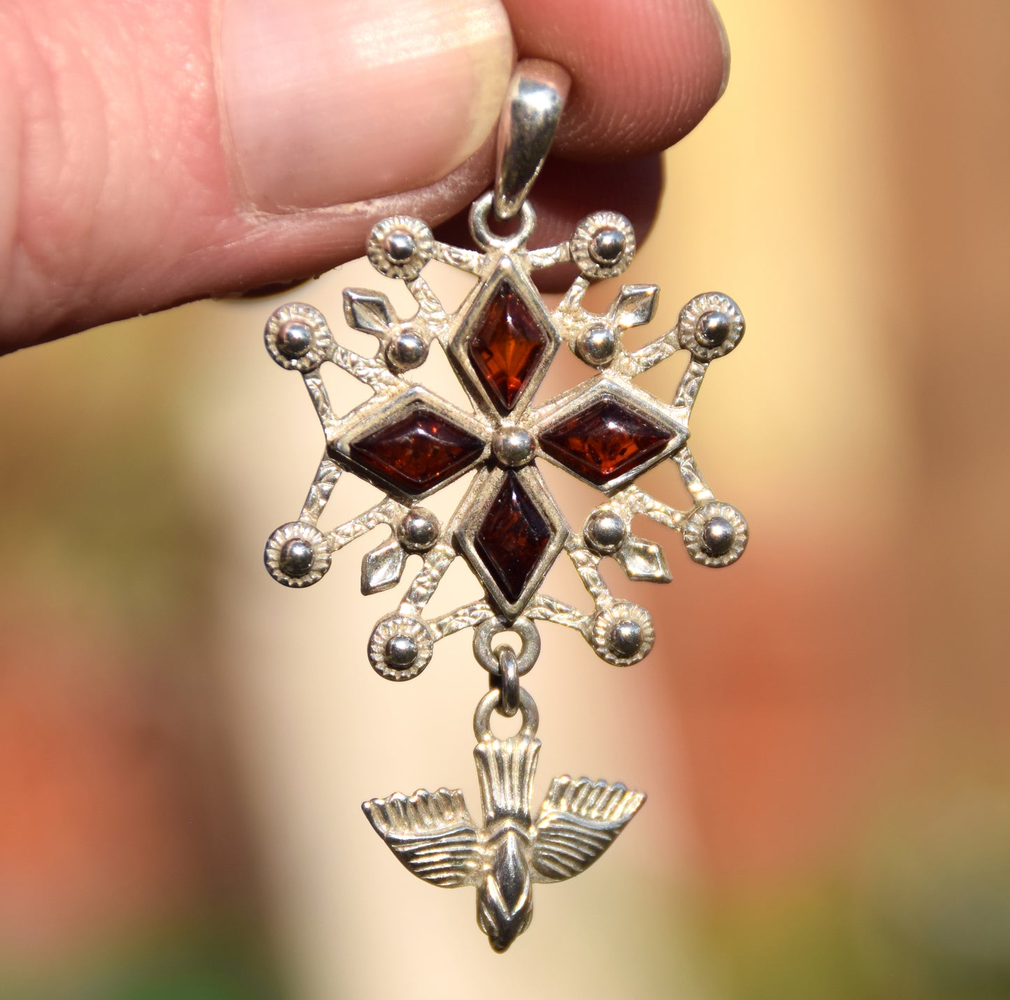 Cross-shaped pendant with a dove in natural brown amber and 925 Sterling Silver, MJ Baltica, BW326