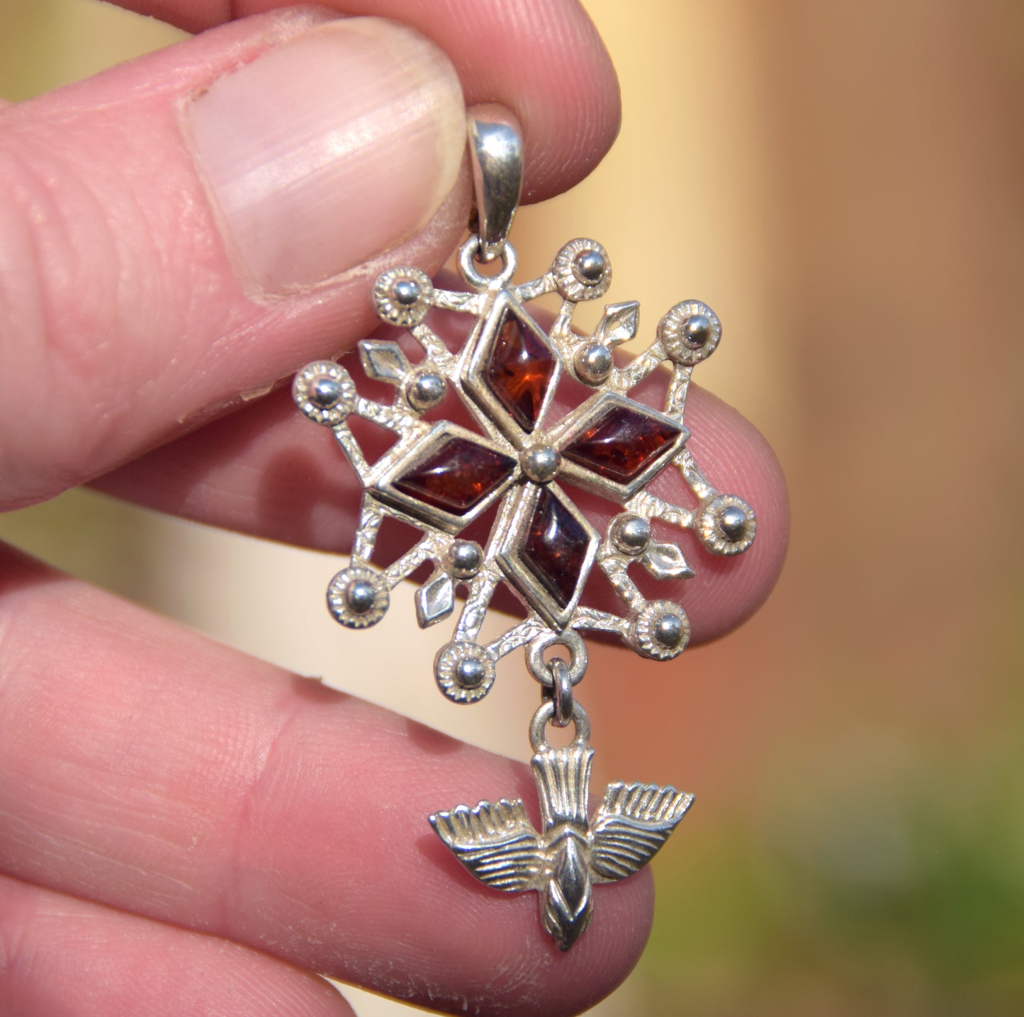 Cross-shaped pendant with a dove in natural brown amber and 925 Sterling Silver, MJ Baltica, BW326