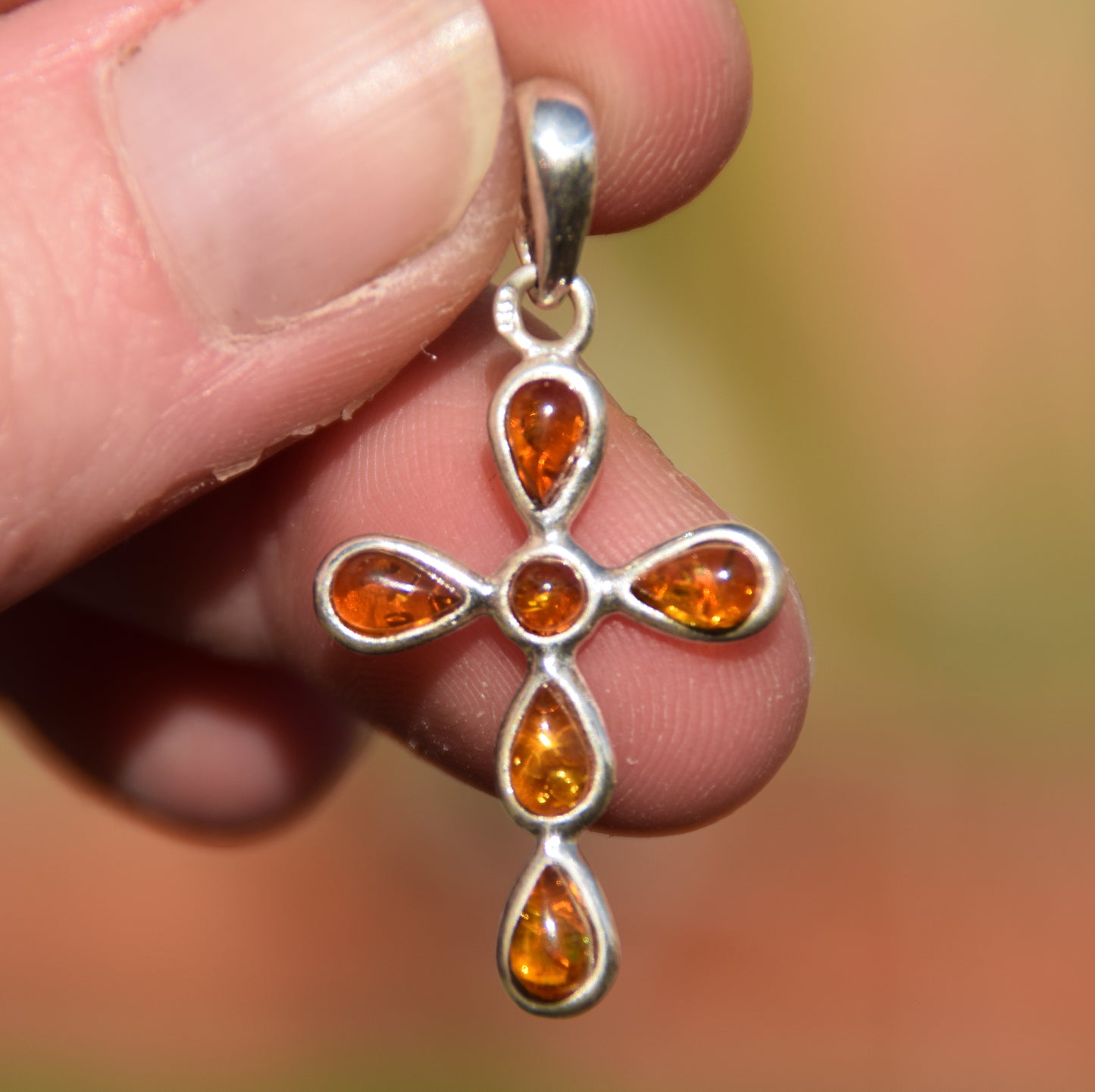 Delicate cross-shaped pendant in natural cognac Amber and 925 Silver, MJ Baltica, BW329