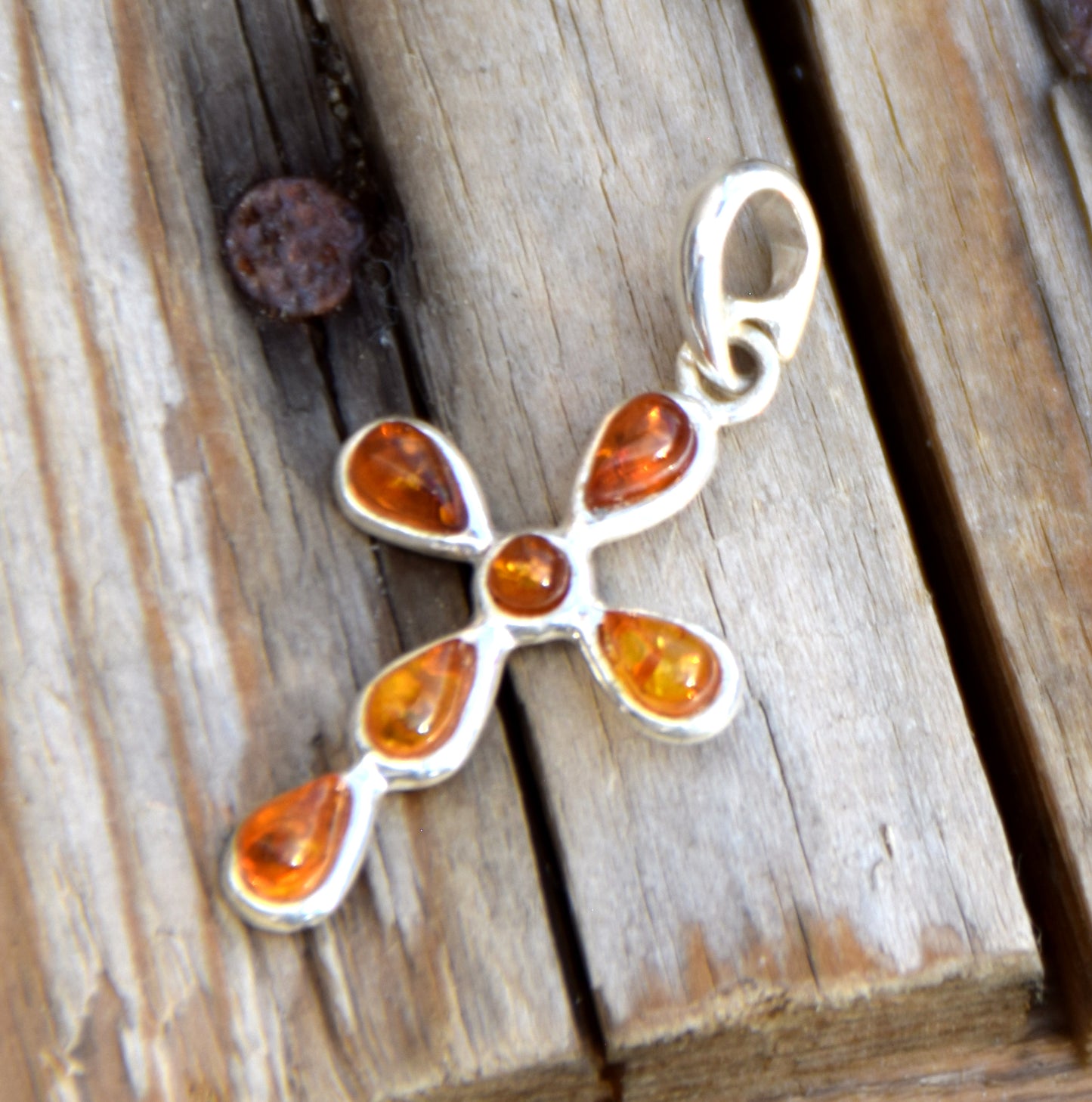 Delicate cross-shaped pendant in natural cognac Amber and 925 Silver, MJ Baltica, BW329