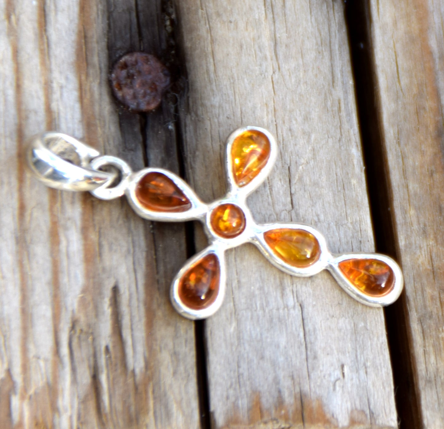Delicate cross-shaped pendant in natural cognac Amber and 925 Silver, MJ Baltica, BW329
