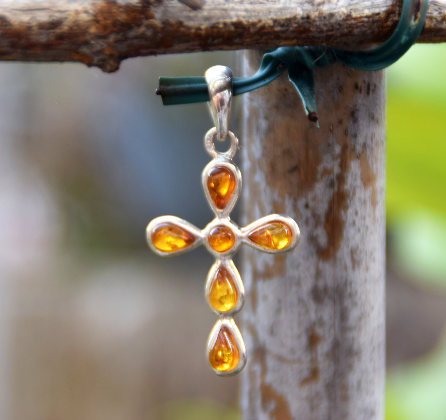 Delicate cross-shaped pendant in natural cognac Amber and 925 Silver, MJ Baltica, BW329