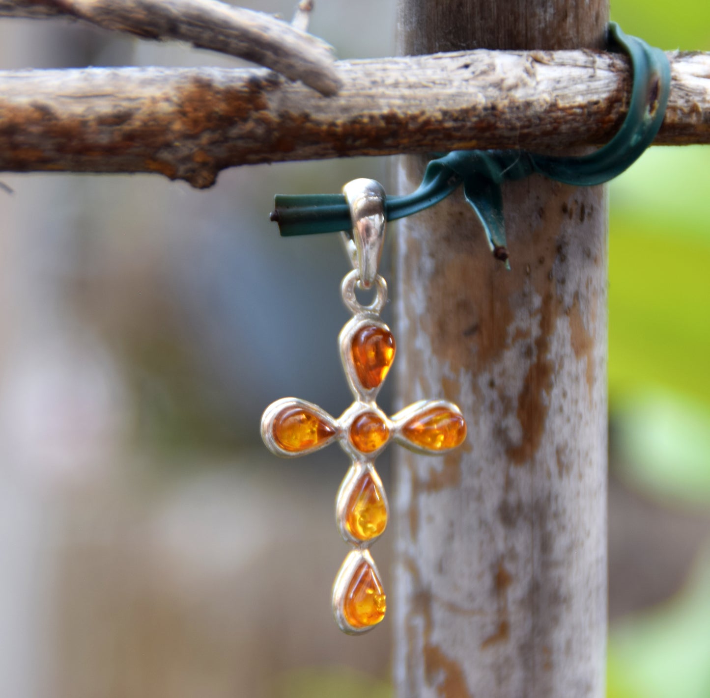 Delicate cross-shaped pendant in natural cognac Amber and 925 Silver, MJ Baltica, BW329
