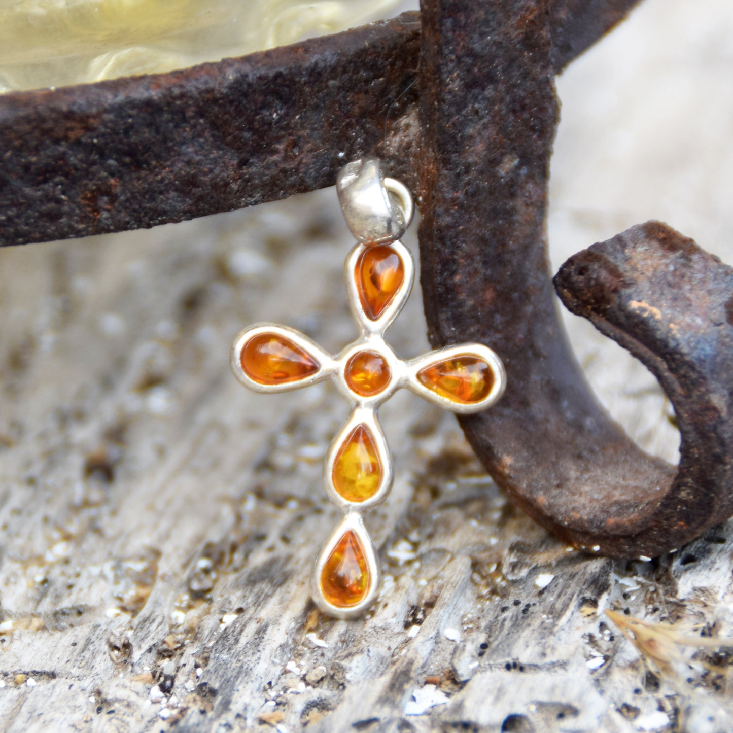 Delicate cross-shaped pendant in natural cognac Amber and 925 Silver, MJ Baltica, BW329