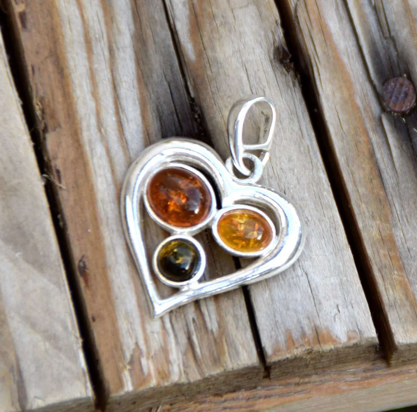 Romantic heart-shaped pendant with natural Amber of various shades and 925 Sterling Silver, MJ Baltica, BW330