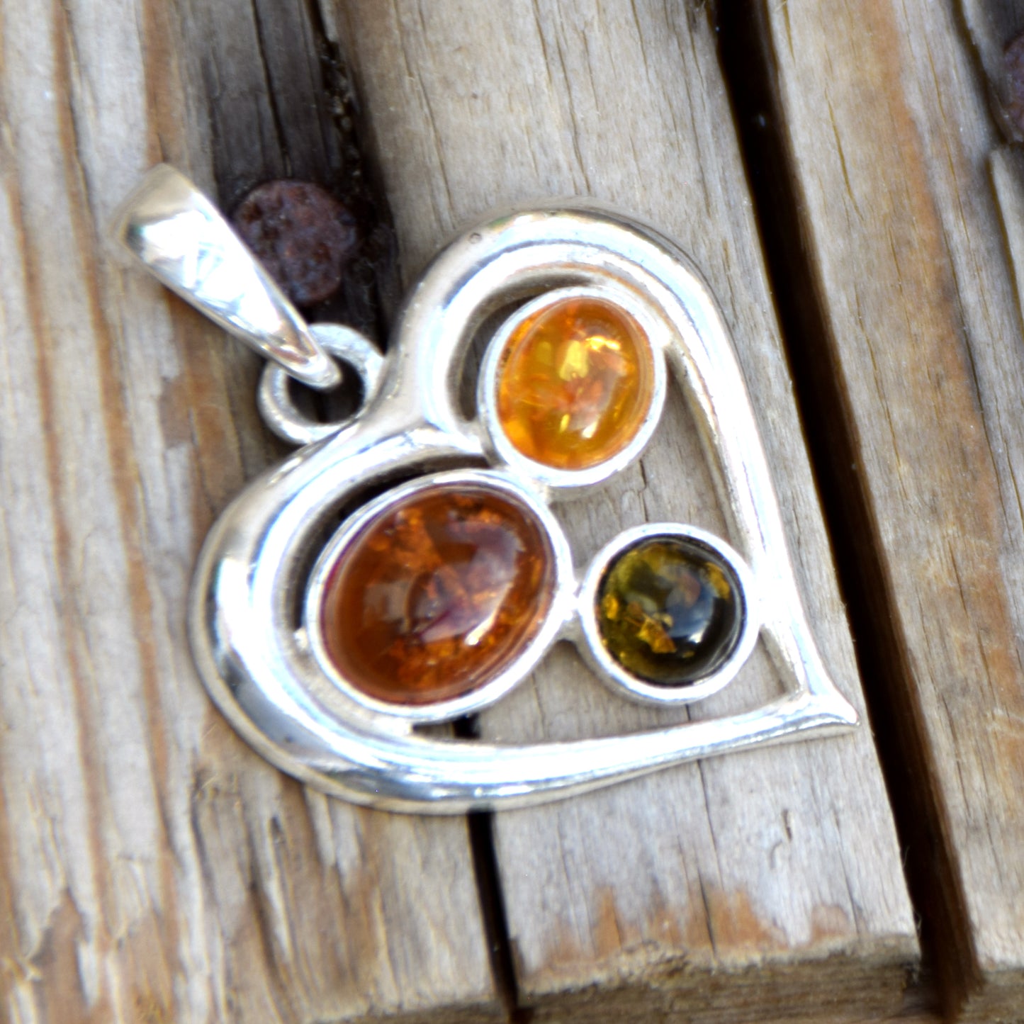 Romantic heart-shaped pendant with natural Amber of various shades and 925 Sterling Silver, MJ Baltica, BW330