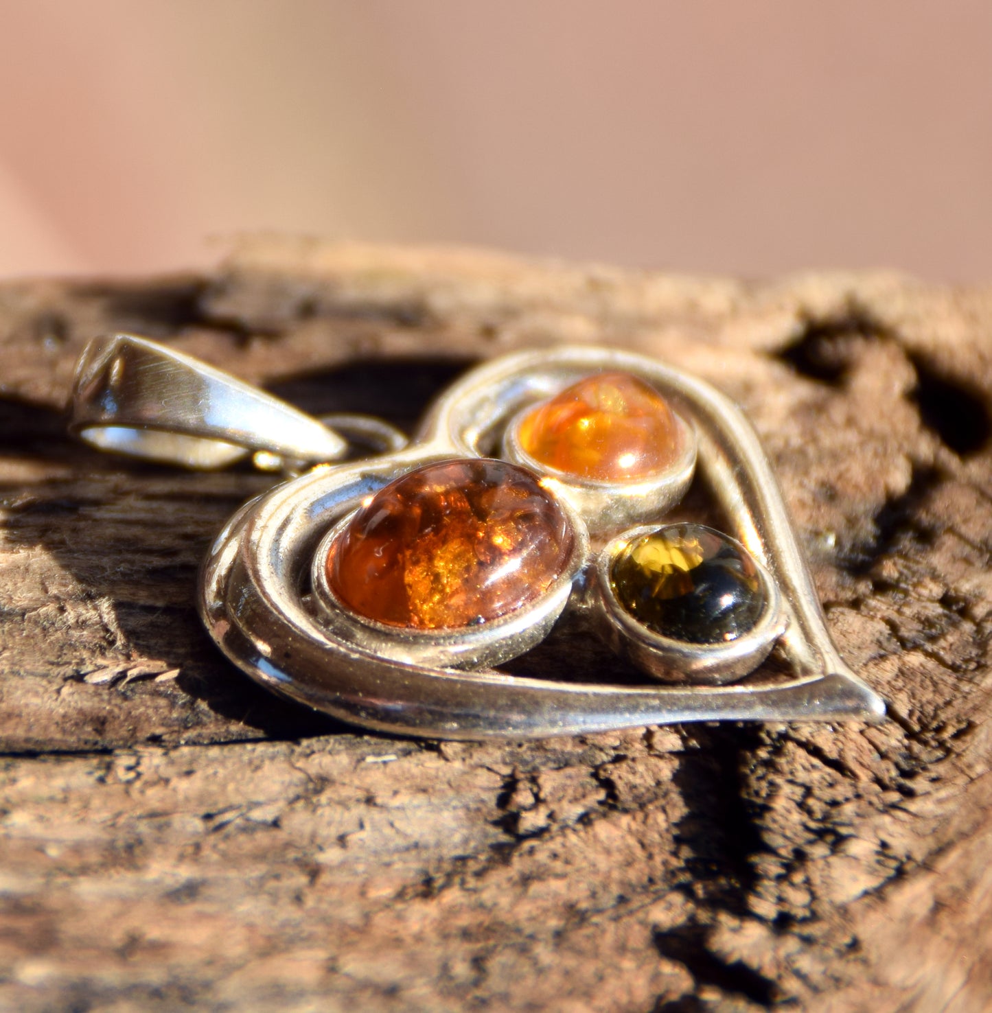 Romantic heart-shaped pendant with natural Amber of various shades and 925 Sterling Silver, MJ Baltica, BW330