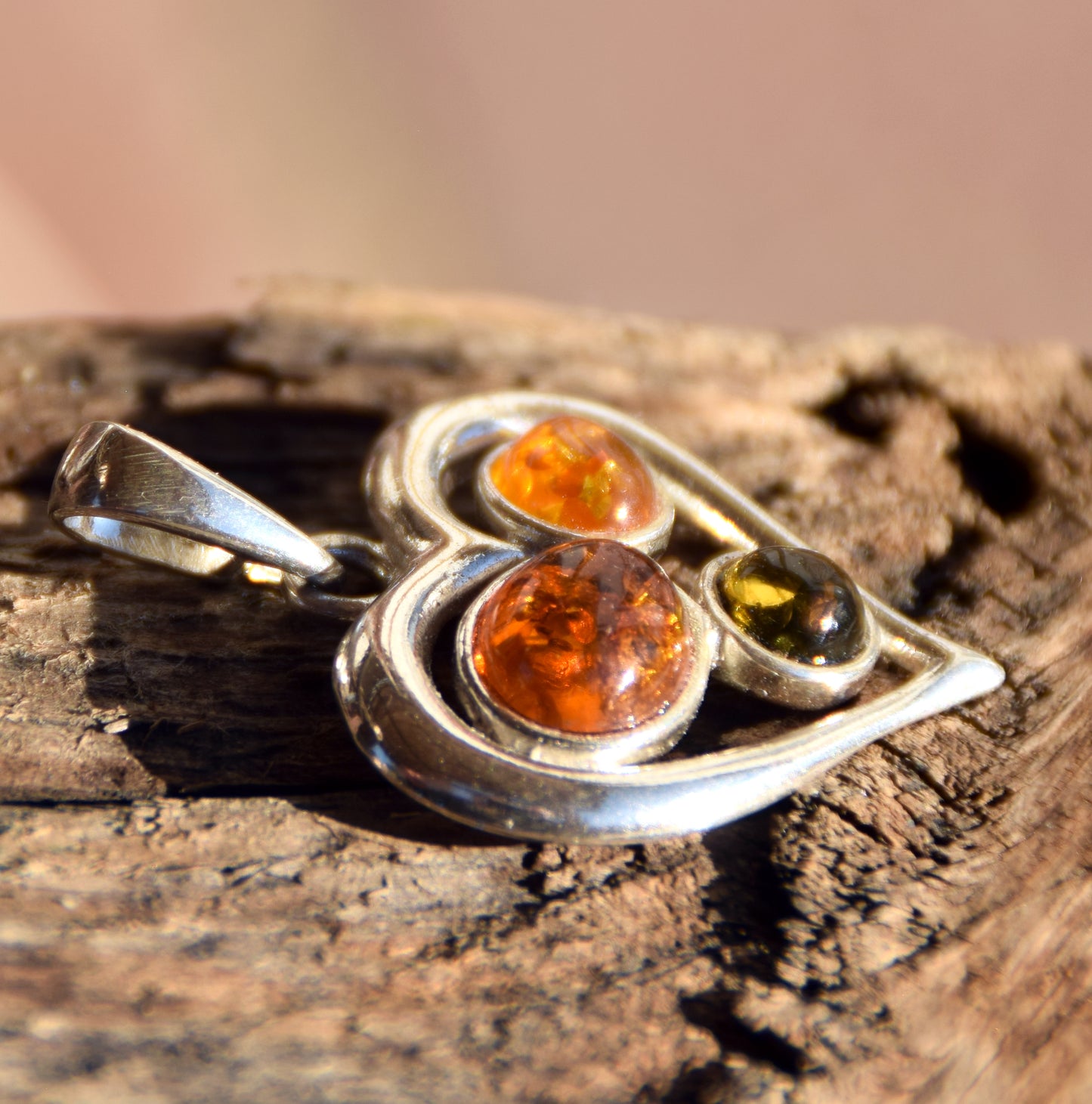 Romantic heart-shaped pendant with natural Amber of various shades and 925 Sterling Silver, MJ Baltica, BW330