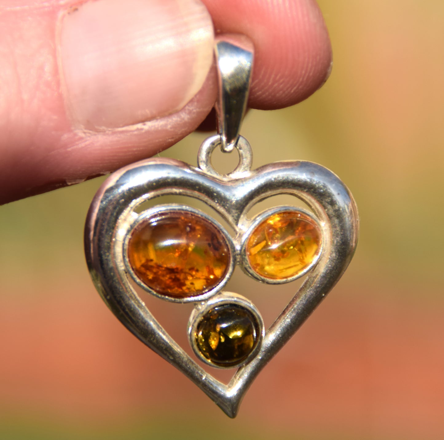 Romantic heart-shaped pendant with natural Amber of various shades and 925 Sterling Silver, MJ Baltica, BW330