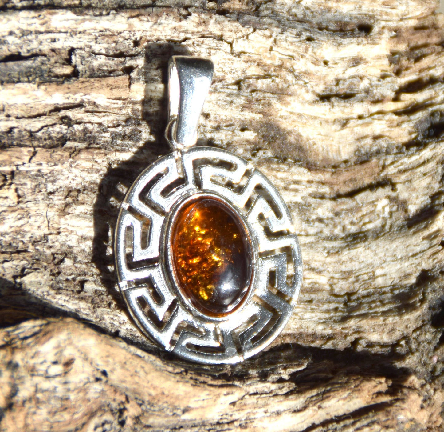 Delicate pendant crafted from natural cognac-colored Amber and 925 Silver, MJ Baltica, BW334