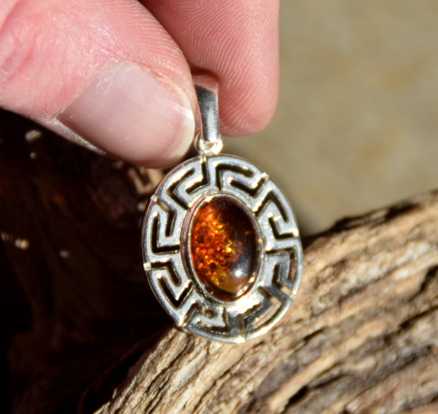 Delicate pendant crafted from natural cognac-colored Amber and 925 Silver, MJ Baltica, BW334