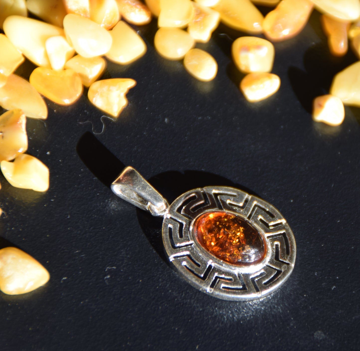 Delicate pendant crafted from natural cognac-colored Amber and 925 Silver, MJ Baltica, BW334