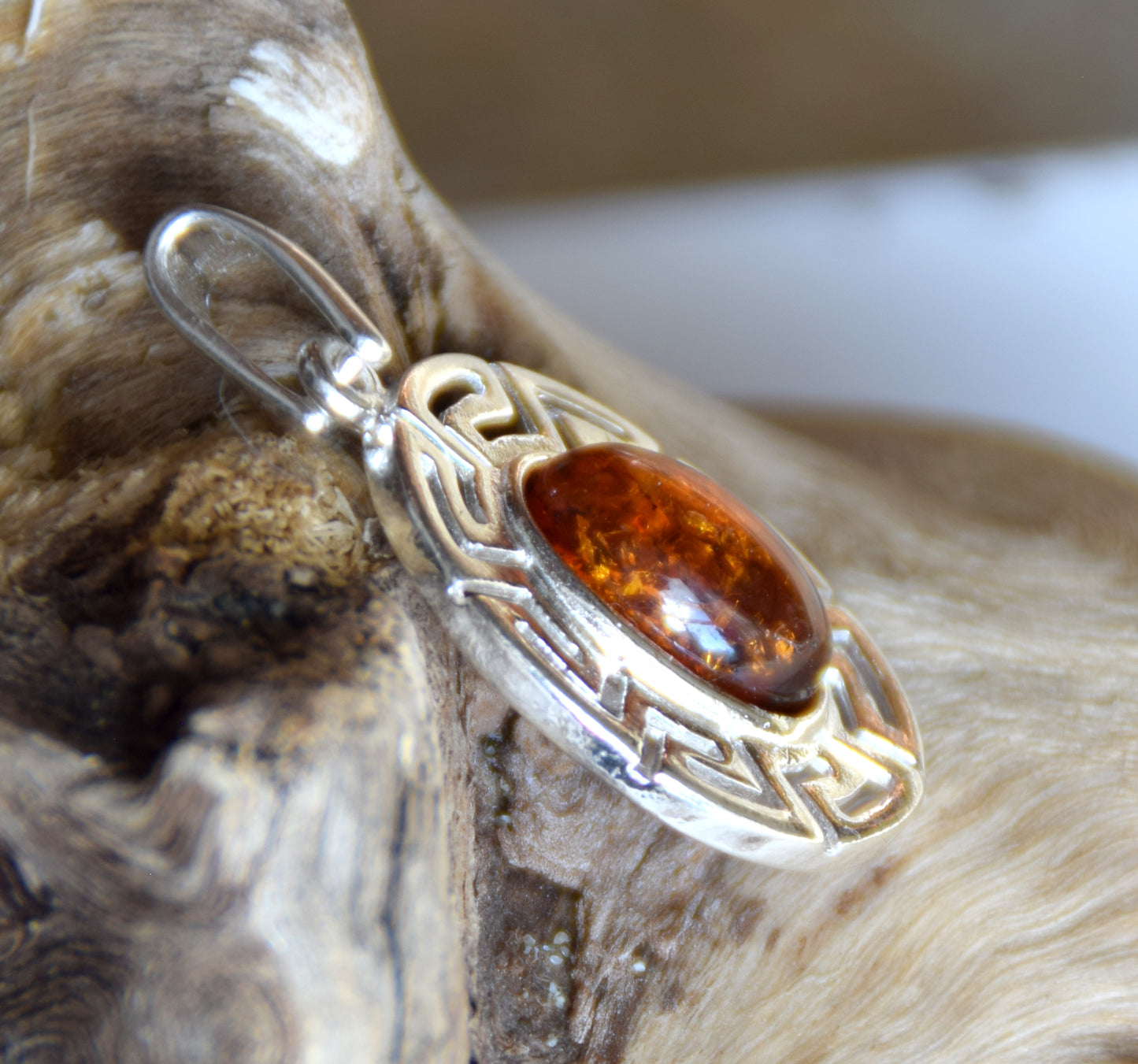 Delicate pendant crafted from natural cognac-colored Amber and 925 Silver, MJ Baltica, BW334