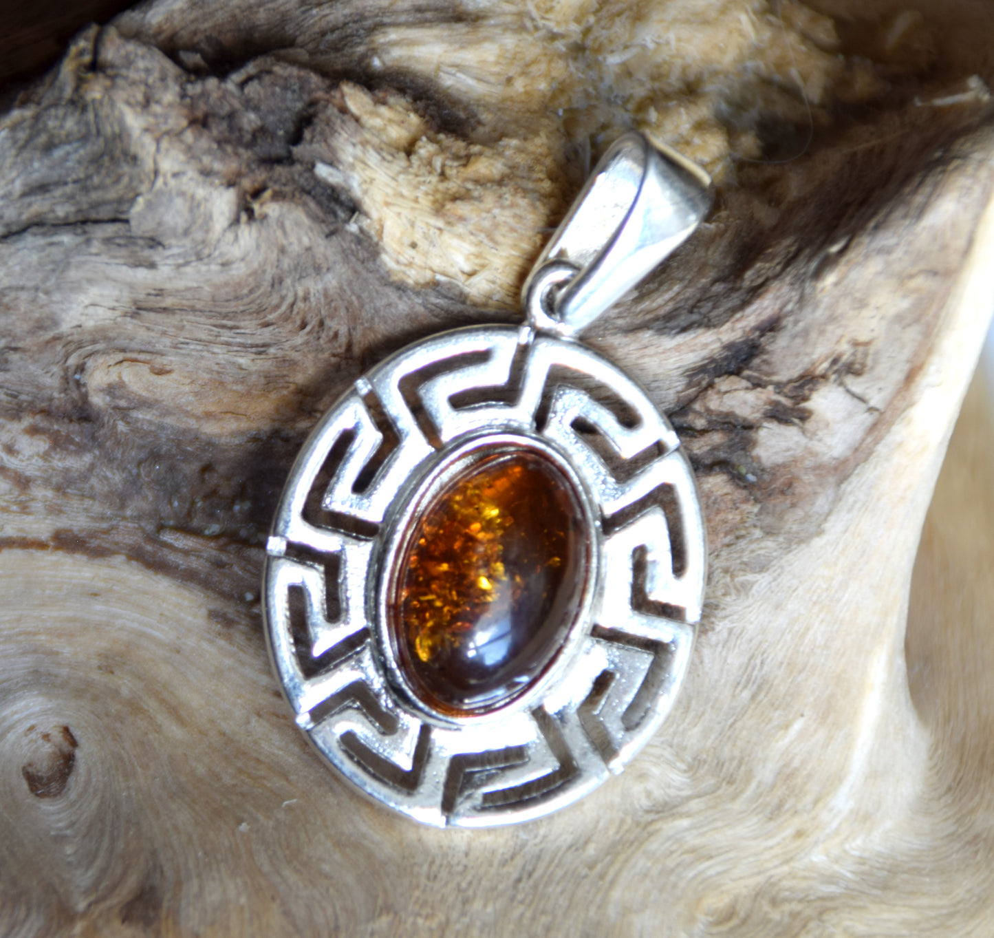 Delicate pendant crafted from natural cognac-colored Amber and 925 Silver, MJ Baltica, BW334