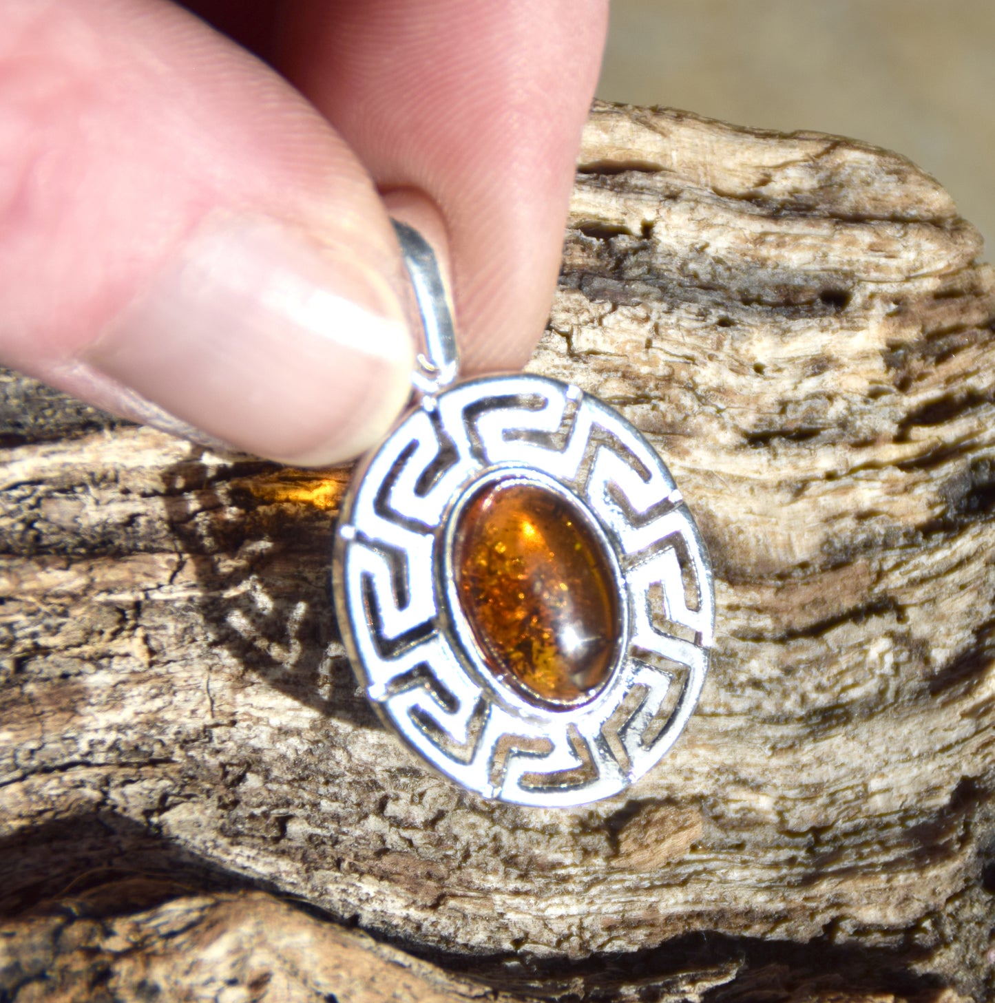 Delicate pendant crafted from natural cognac-colored Amber and 925 Silver, MJ Baltica, BW334