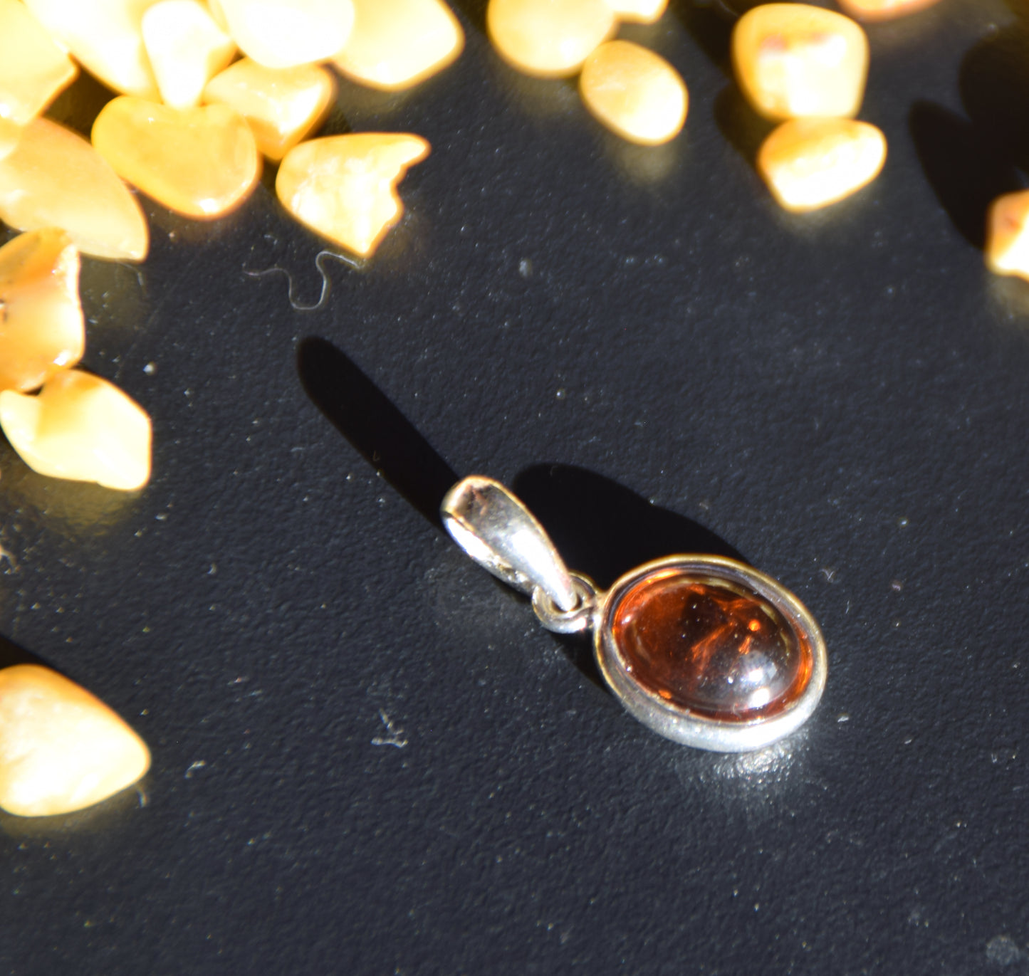 Delicate pendant created with natural cognac-colored Amber and Sterling Silver 925, MJ Baltica, BW335