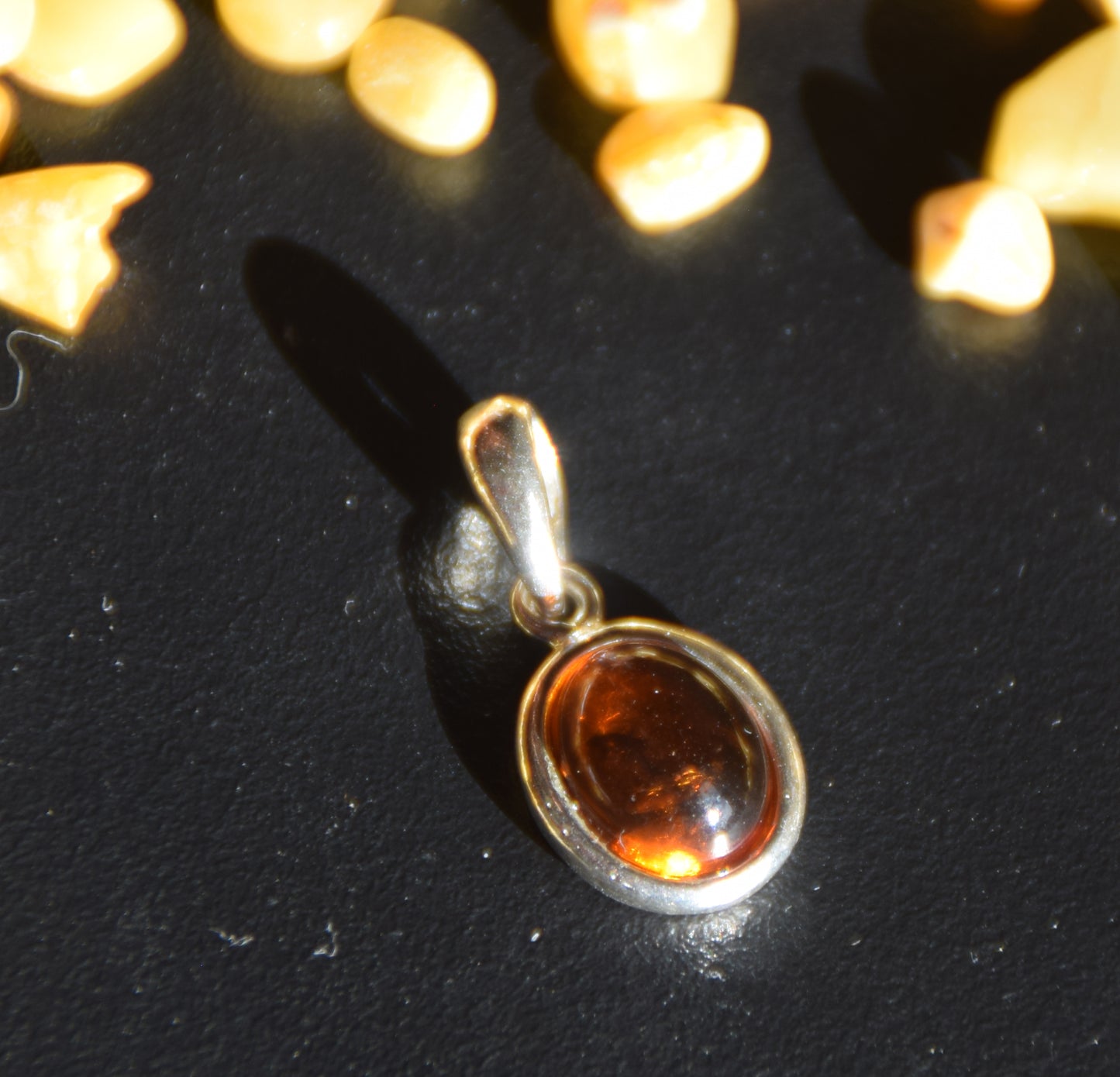 Delicate pendant created with natural cognac-colored Amber and Sterling Silver 925, MJ Baltica, BW335