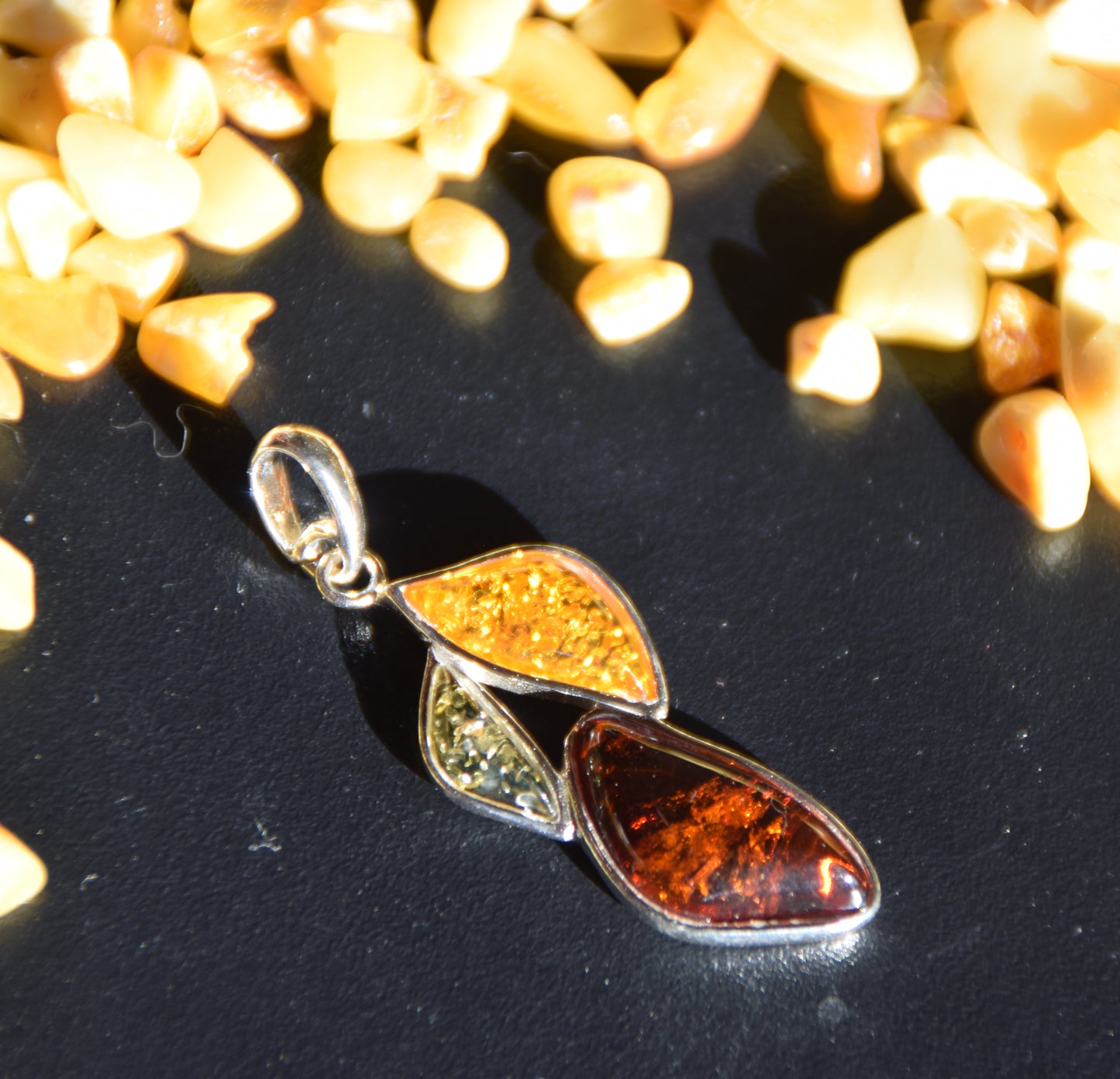 Bright floral pendant with natural Amber in various shades, set in 925 Sterling Silver, MJ Baltica, BW336