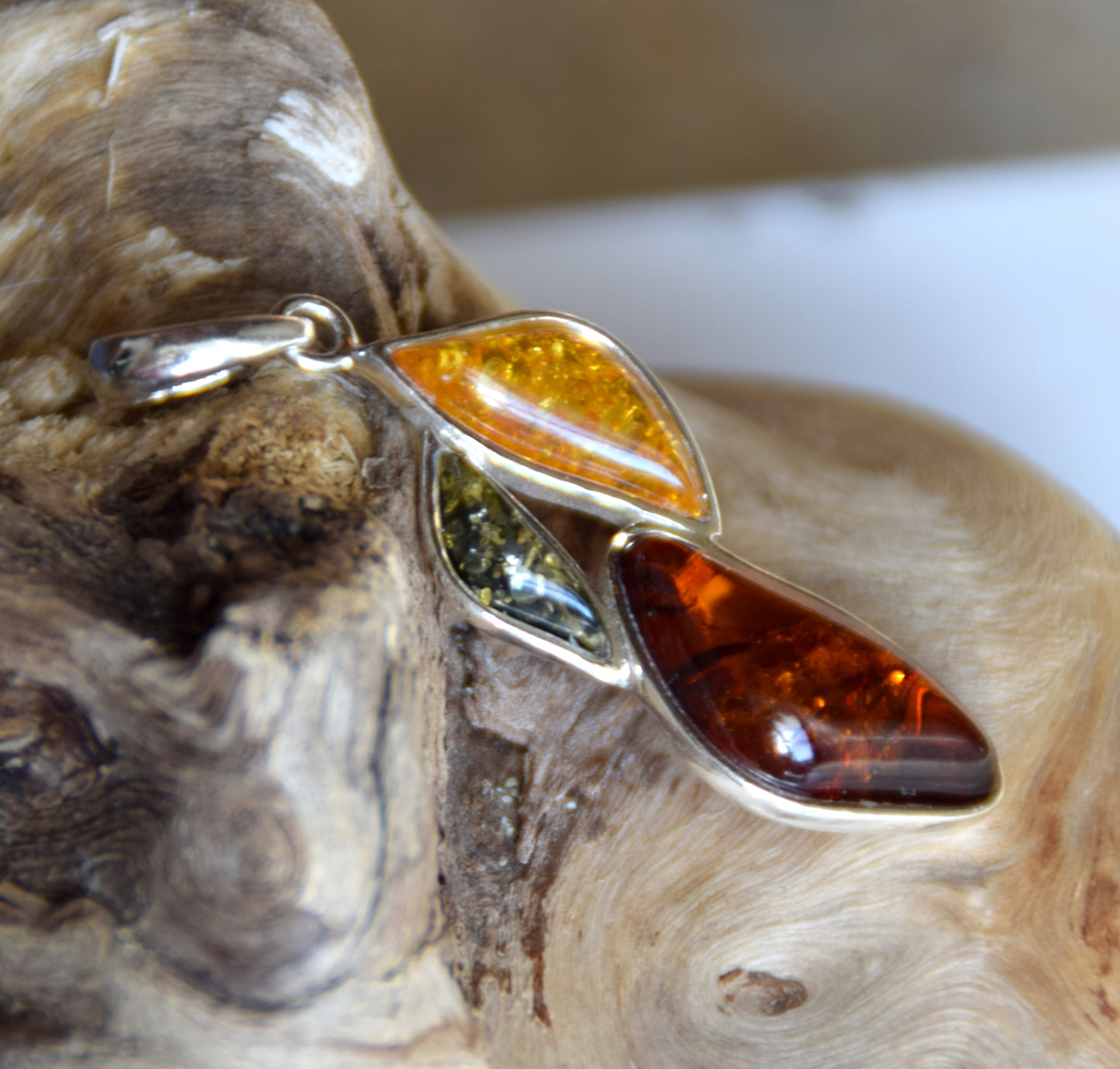 Bright floral pendant with natural Amber in various shades, set in 925 Sterling Silver, MJ Baltica, BW336