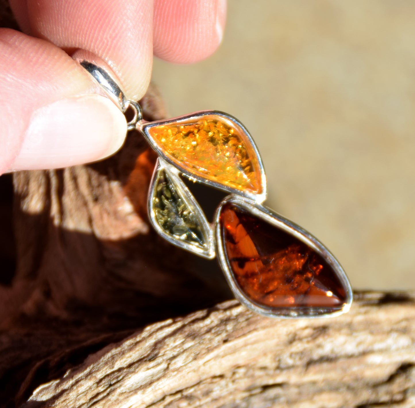 Bright floral pendant with natural Amber in various shades, set in 925 Sterling Silver, MJ Baltica, BW336