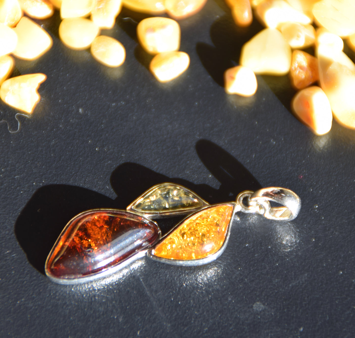 Bright floral pendant with natural Amber in various shades, set in 925 Sterling Silver, MJ Baltica, BW336