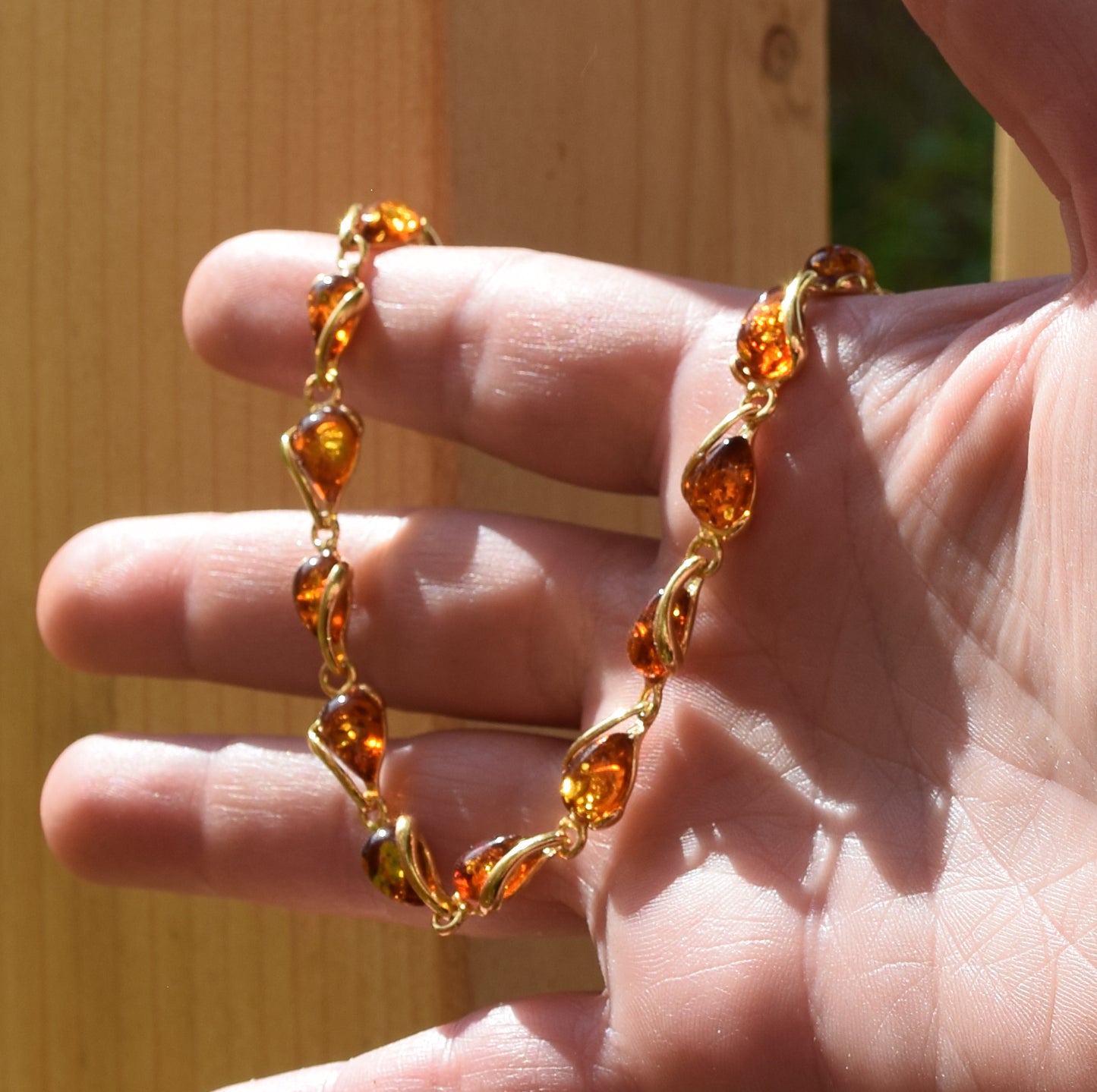 Luminous bracelet with cognac-colored natural Amber drops and 18k Gold-plated 925 Sterling Silver, MJ Baltica, BZB020