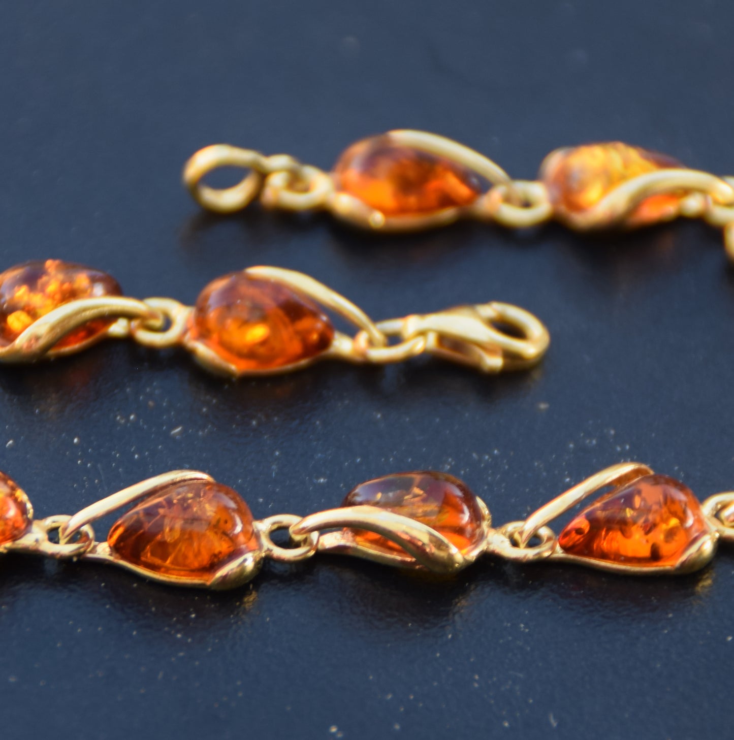 Luminous bracelet with cognac-colored natural Amber drops and 18k Gold-plated 925 Sterling Silver, MJ Baltica, BZB020