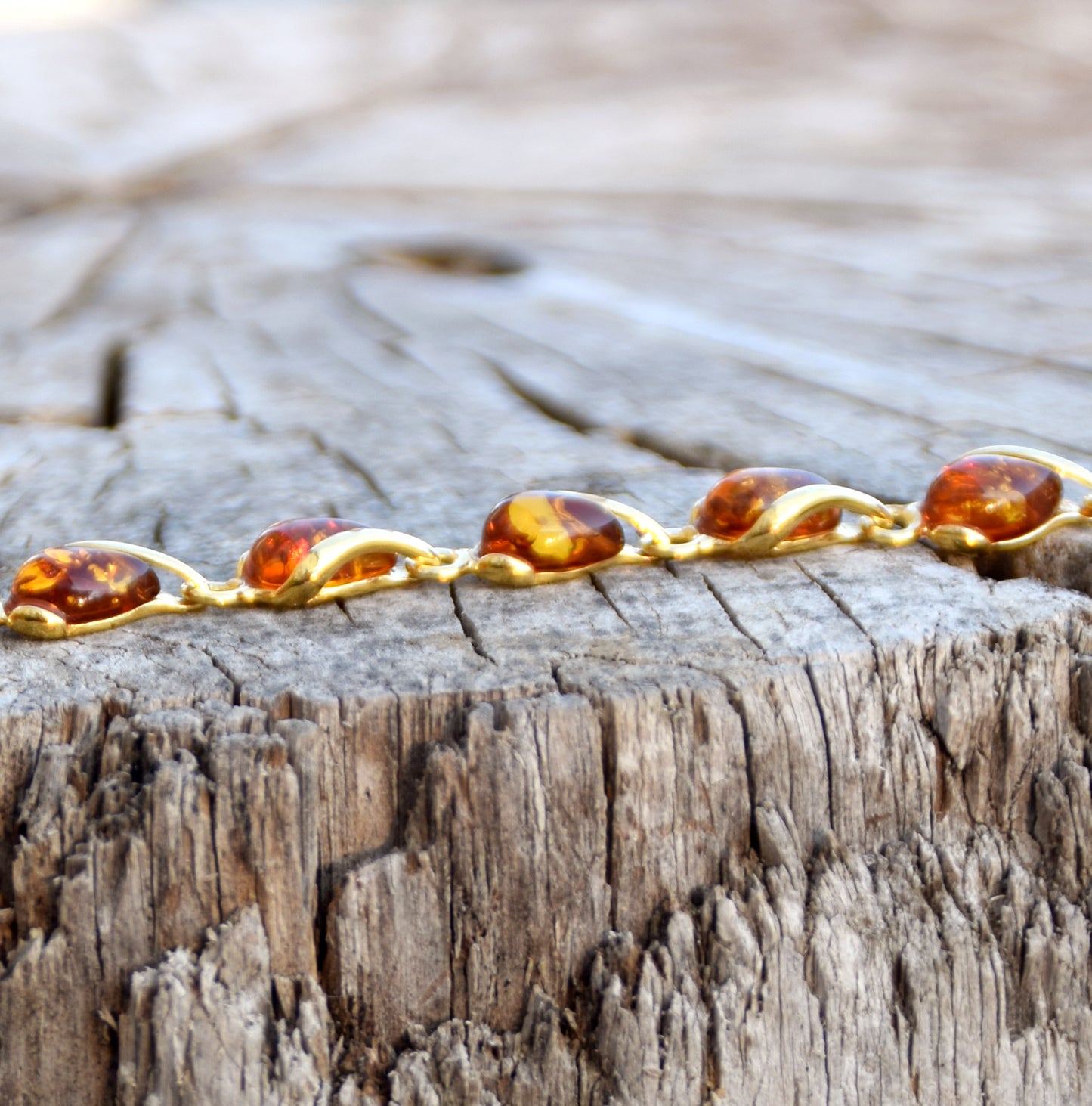 Luminous bracelet with cognac-colored natural Amber drops and 18k Gold-plated 925 Sterling Silver, MJ Baltica, BZB020