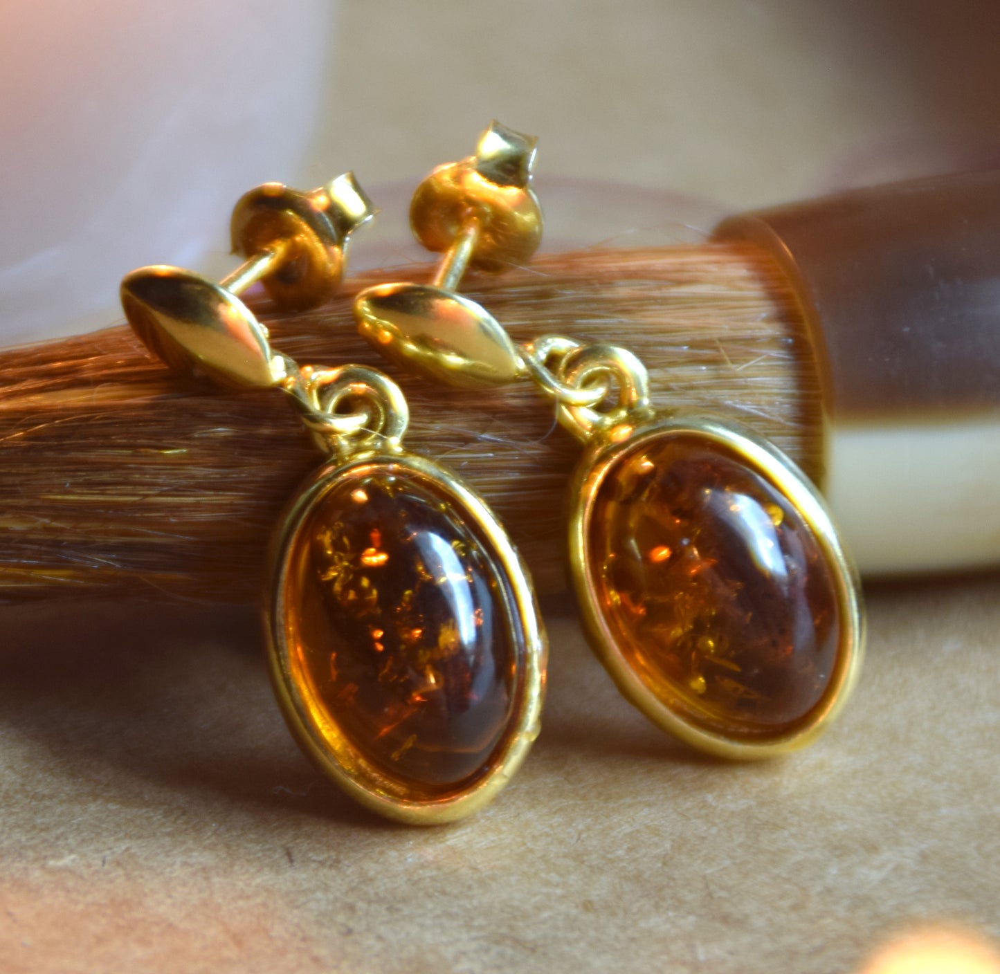 Elegant oval earrings in natural cognac Amber and 18k Gold plated 925 Sterling Silver, MJ Baltica, BZK171