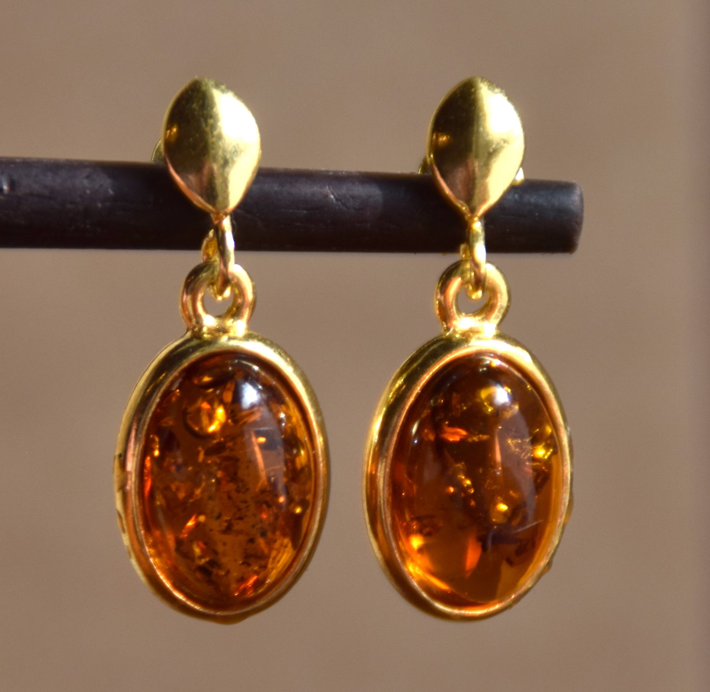 Elegant oval earrings in natural cognac Amber and 18k Gold plated 925 Sterling Silver, MJ Baltica, BZK171