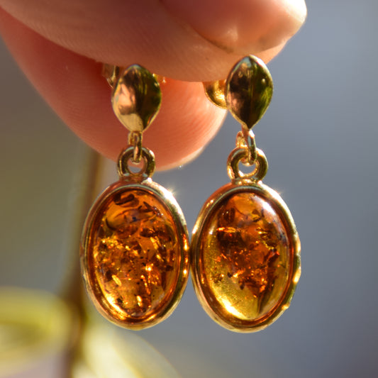 Elegant oval earrings in natural cognac Amber and 18k Gold plated 925 Sterling Silver, MJ Baltica, BZK171