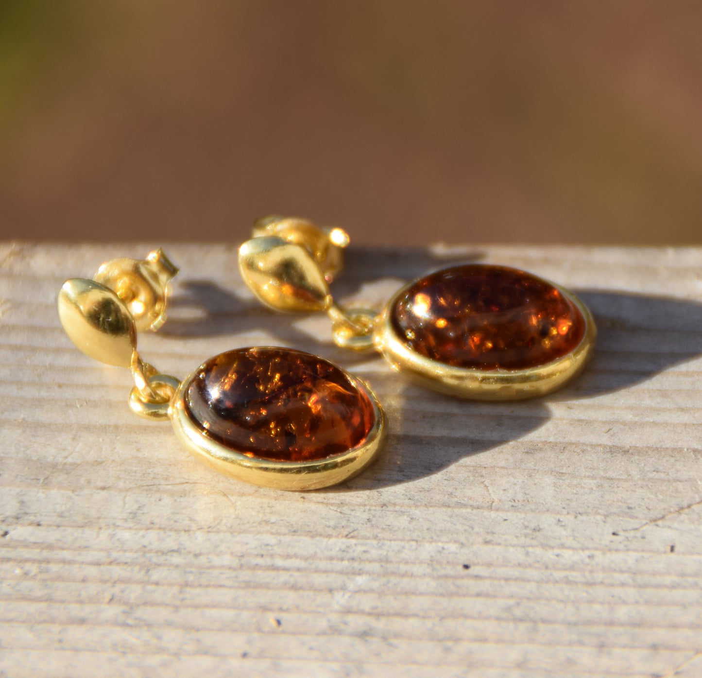 Elegant oval earrings in natural cognac Amber and 18k Gold plated 925 Sterling Silver, MJ Baltica, BZK171