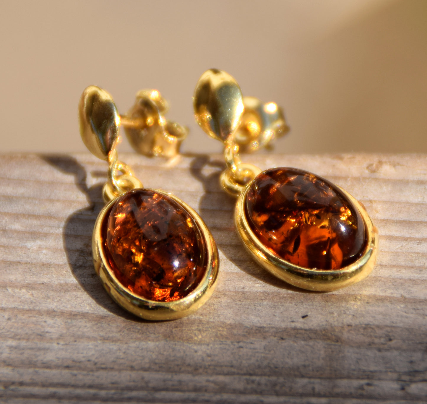 Elegant oval earrings in natural cognac Amber and 18k Gold plated 925 Sterling Silver, MJ Baltica, BZK171
