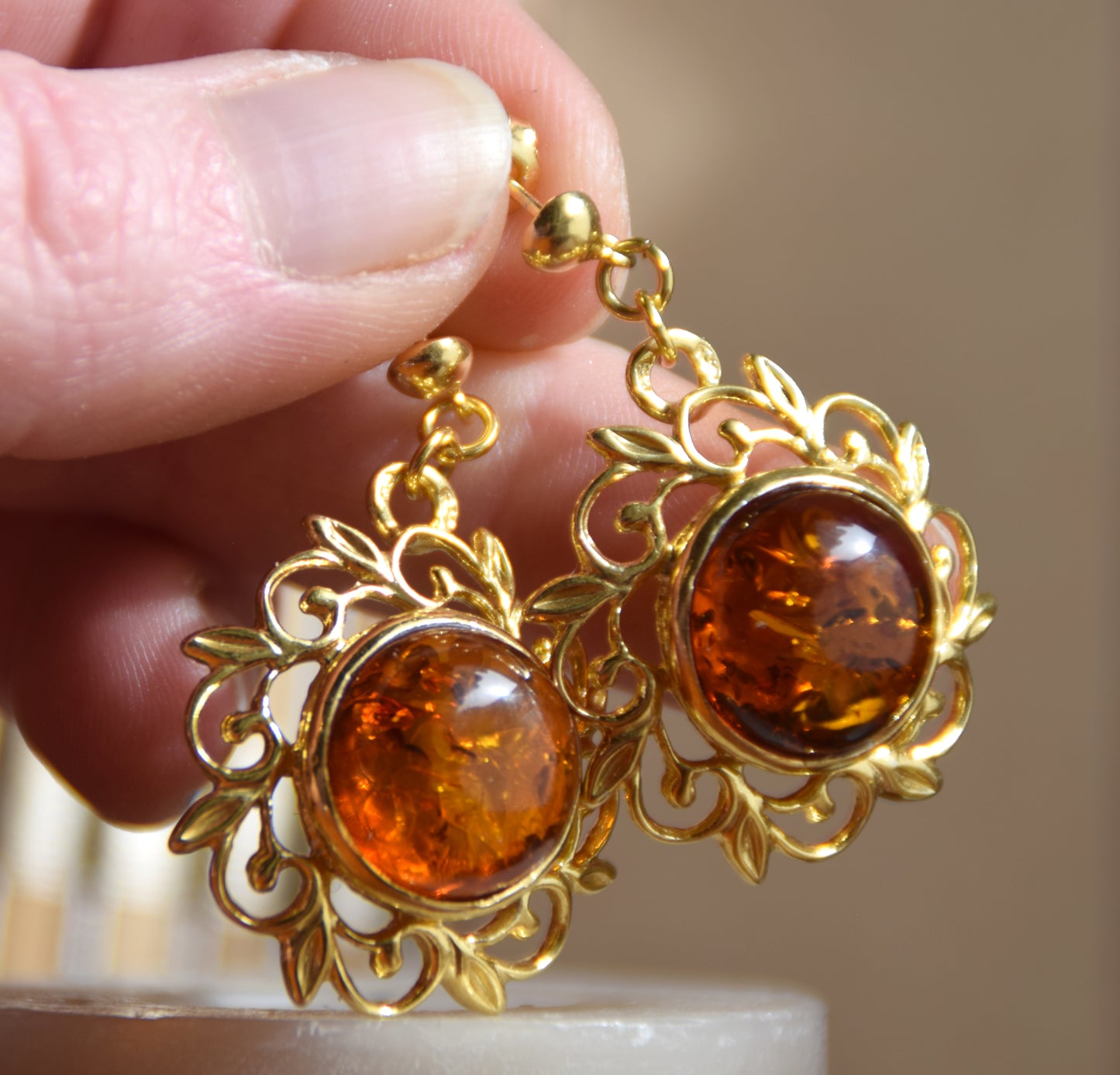Elegant round floral earrings crafted from natural cognac amber and 18k gold-plated 925 sterling silver, MJ Baltica, BZK180