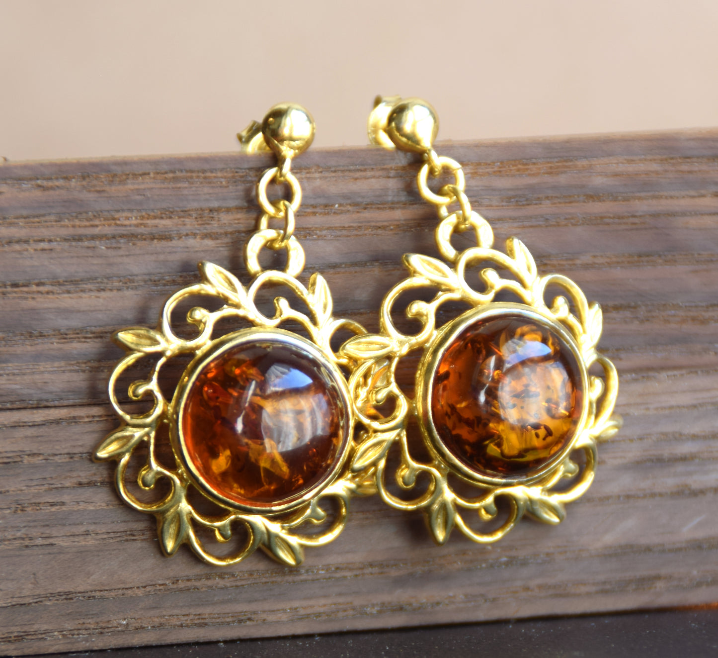 Elegant round floral earrings crafted from natural cognac amber and 18k gold-plated 925 sterling silver, MJ Baltica, BZK180