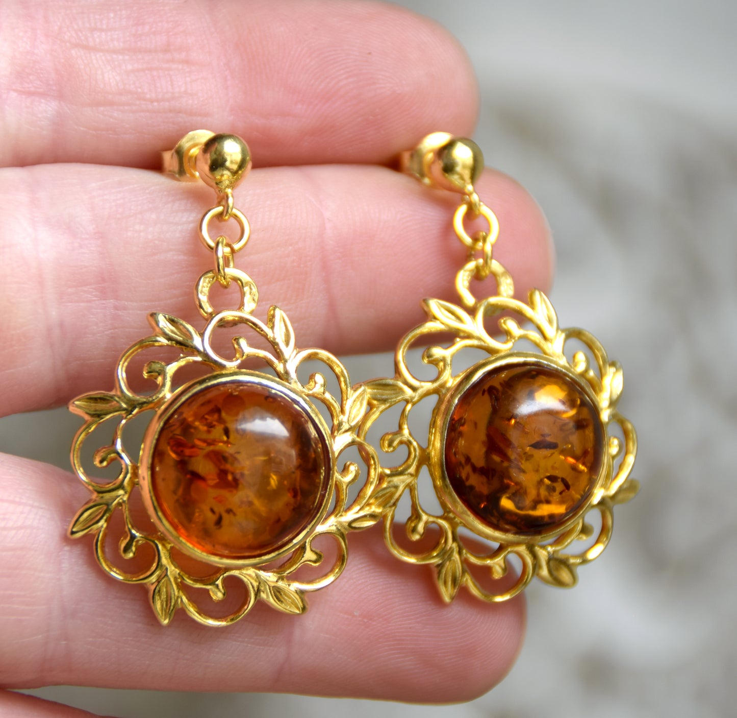 Elegant round floral earrings crafted from natural cognac amber and 18k gold-plated 925 sterling silver, MJ Baltica, BZK180