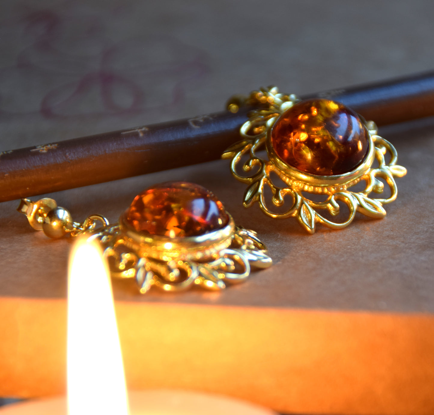 Elegant round floral earrings crafted from natural cognac amber and 18k gold-plated 925 sterling silver, MJ Baltica, BZK180
