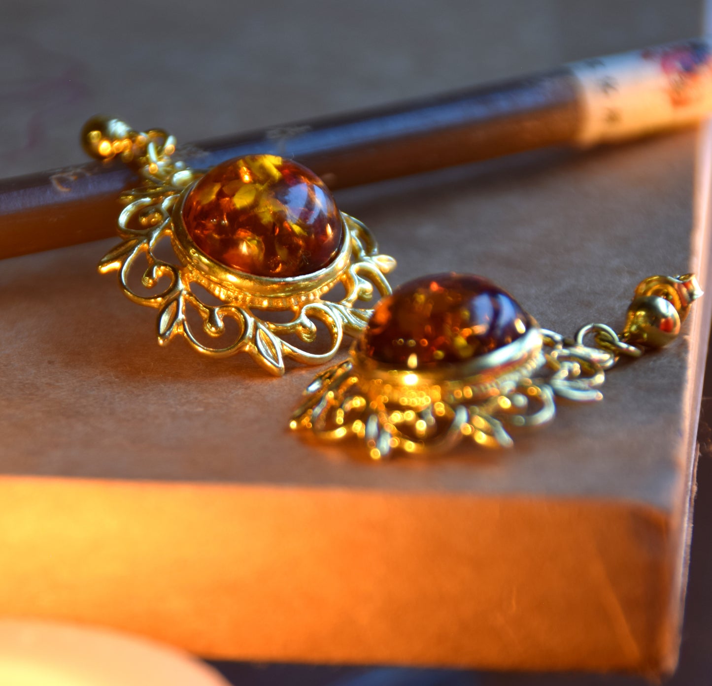 Elegant round floral earrings crafted from natural cognac amber and 18k gold-plated 925 sterling silver, MJ Baltica, BZK180