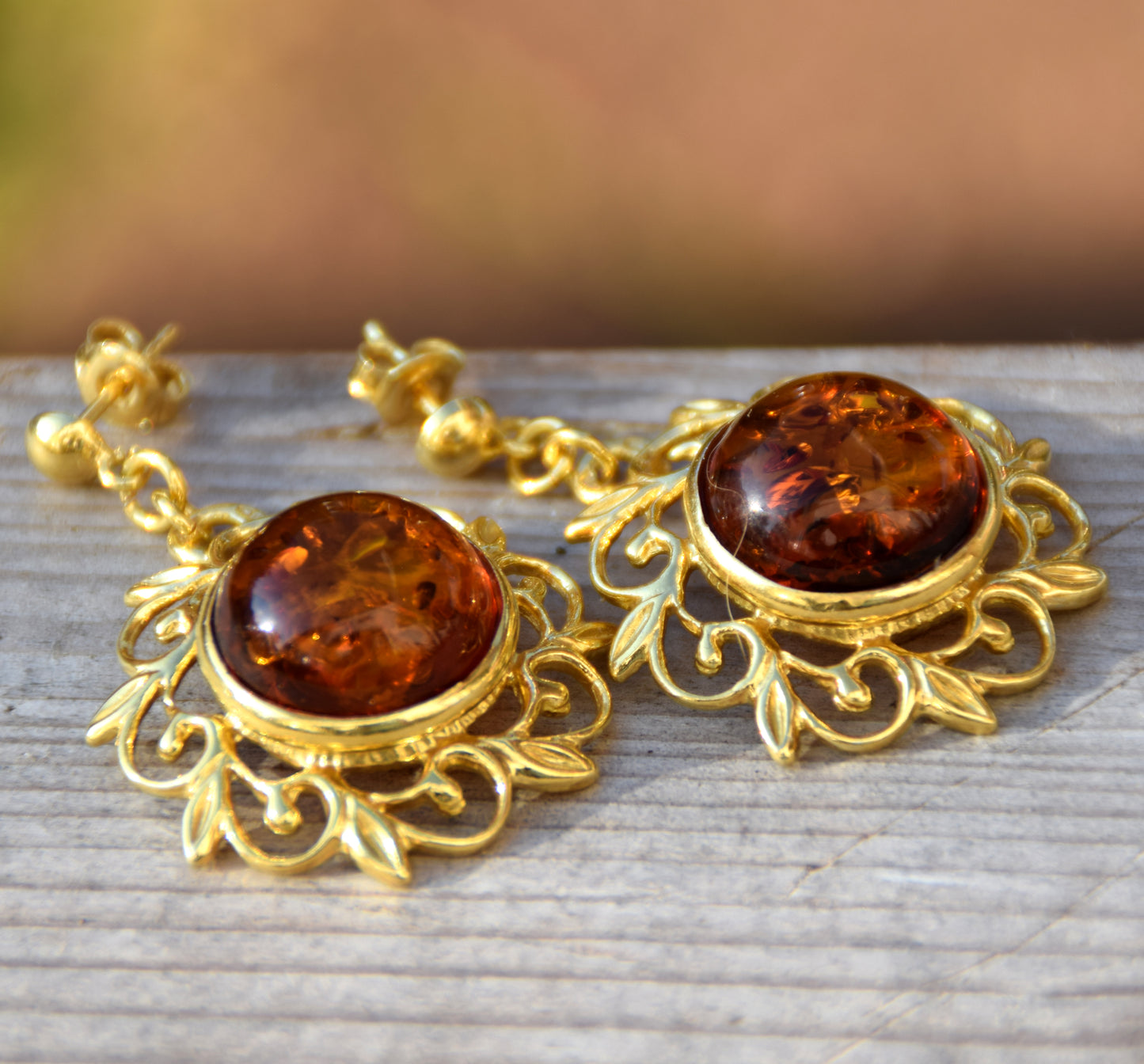 Elegant round floral earrings crafted from natural cognac amber and 18k gold-plated 925 sterling silver, MJ Baltica, BZK180
