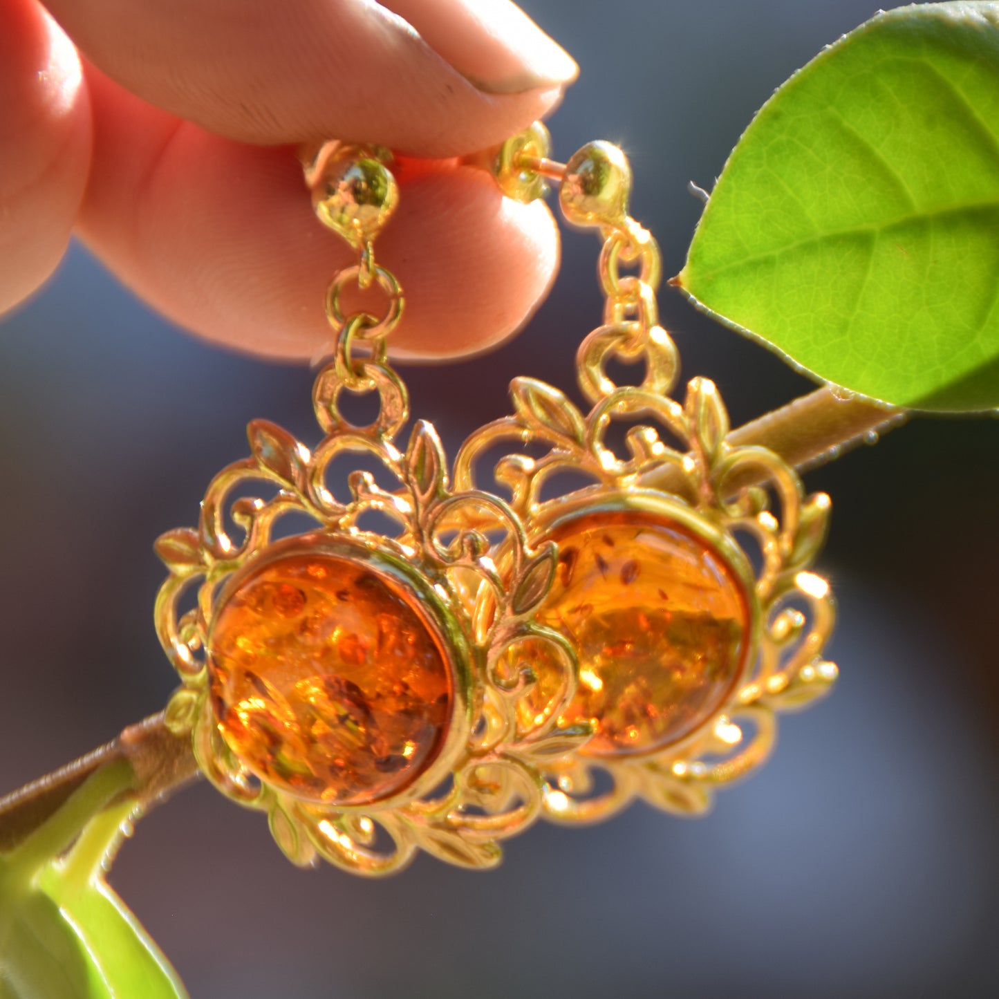 Elegant round floral earrings crafted from natural cognac amber and 18k gold-plated 925 sterling silver, MJ Baltica, BZK180