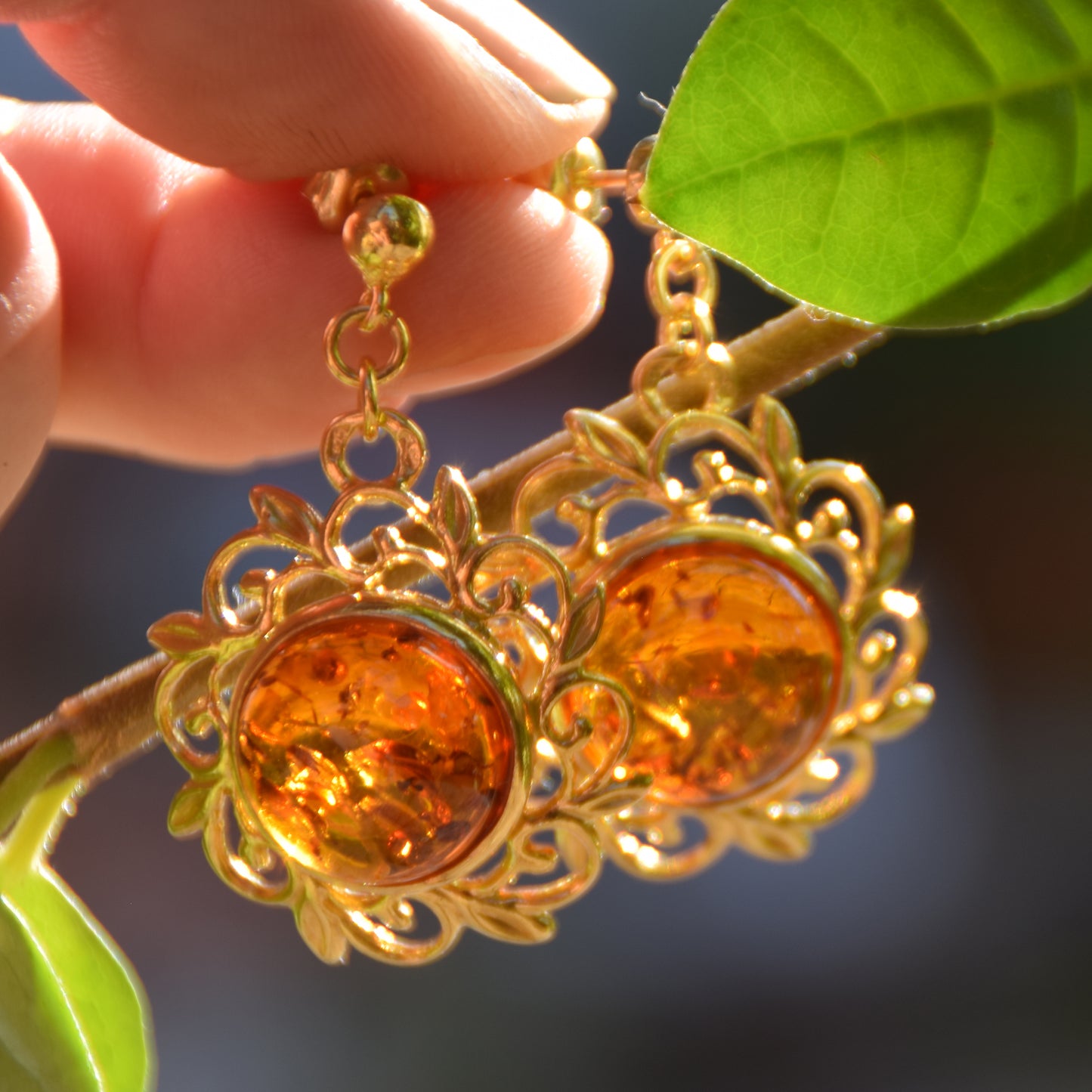 Elegant round floral earrings crafted from natural cognac amber and 18k gold-plated 925 sterling silver, MJ Baltica, BZK180