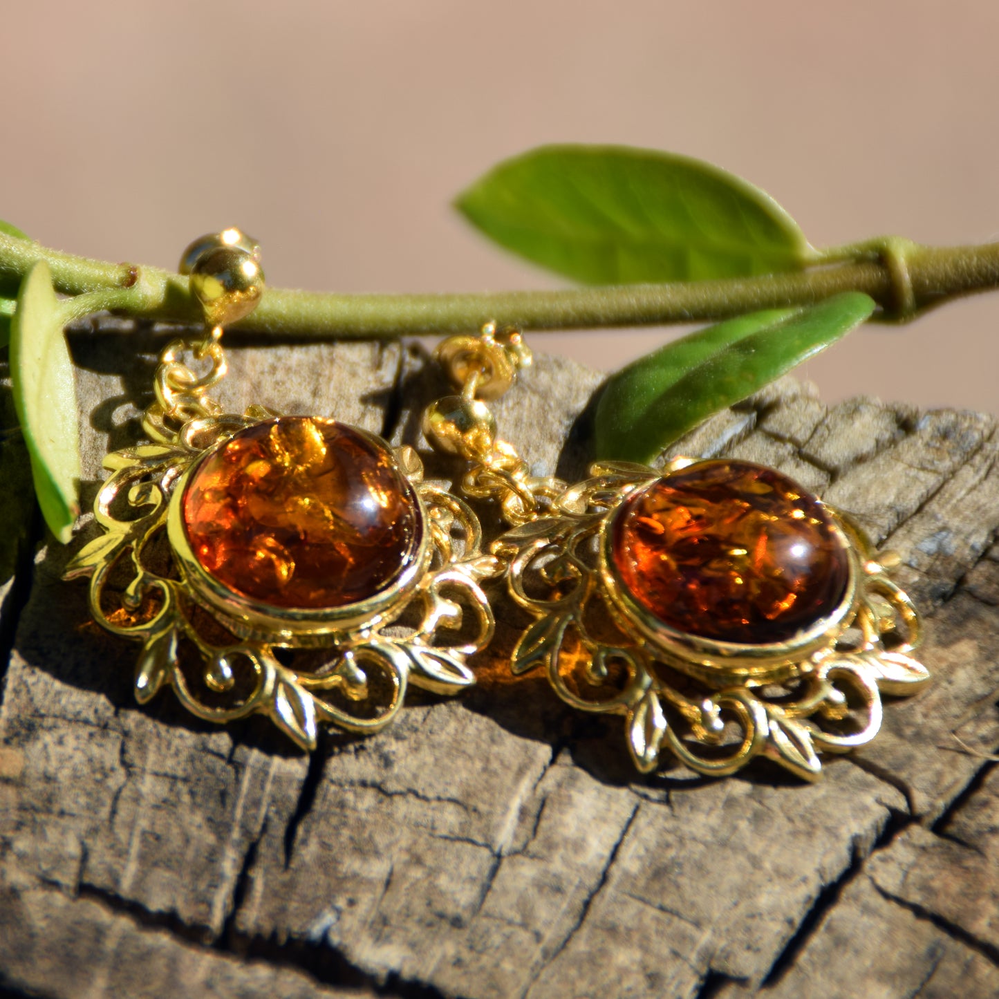 Elegant round floral earrings crafted from natural cognac amber and 18k gold-plated 925 sterling silver, MJ Baltica, BZK180