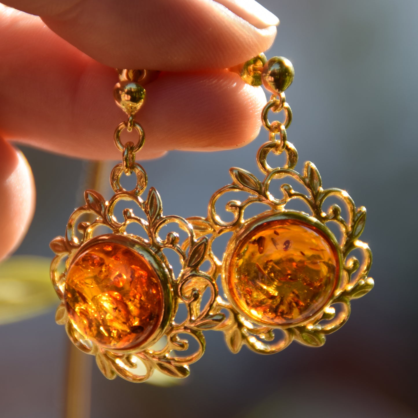 Elegant round floral earrings crafted from natural cognac amber and 18k gold-plated 925 sterling silver, MJ Baltica, BZK180