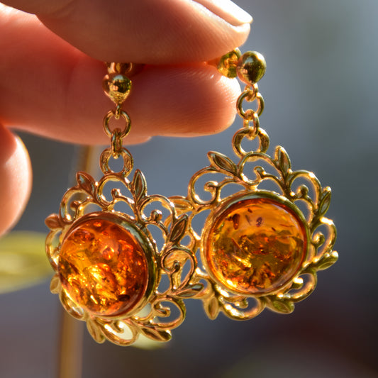 Elegant round floral earrings crafted from natural cognac amber and 18k gold-plated 925 sterling silver, MJ Baltica, BZK180