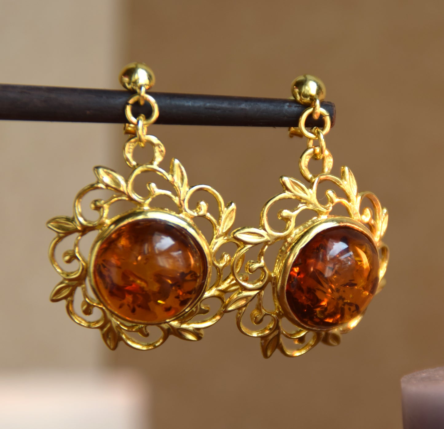 Elegant round floral earrings crafted from natural cognac amber and 18k gold-plated 925 sterling silver, MJ Baltica, BZK180